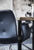 Gięte krzesło Hansen Primum z podłokietlami czarne kółka, skóra Tartufo Davos