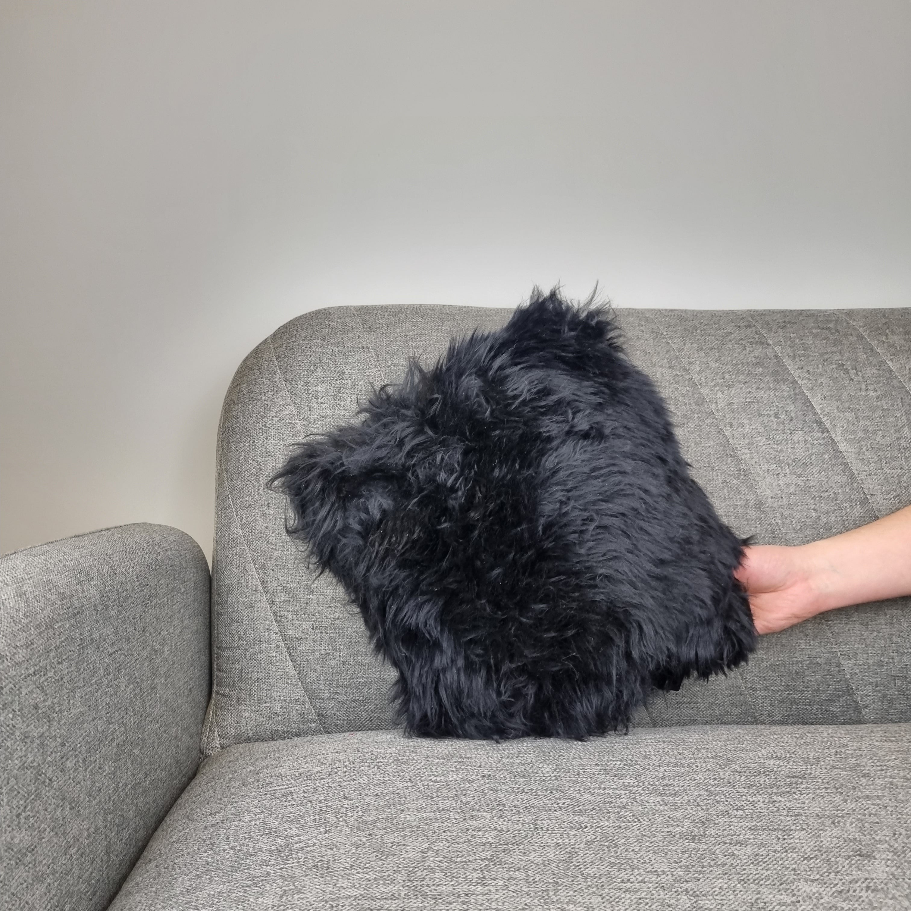 Black genuine sheepskin throw pillow